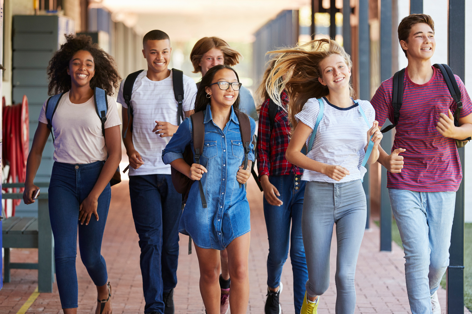 Teenager School Kids Running in High School Hallway